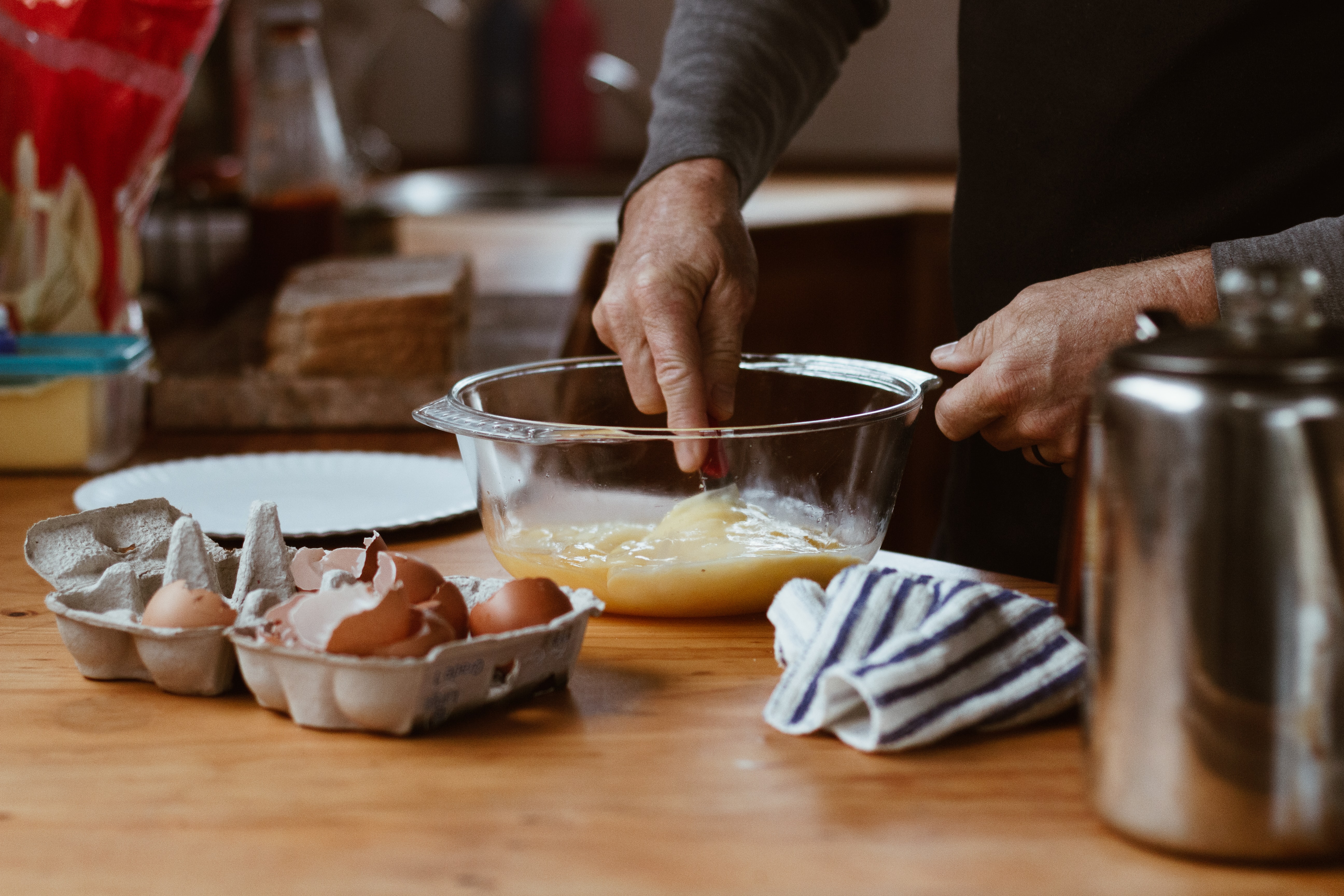 gran hands mixing eggs